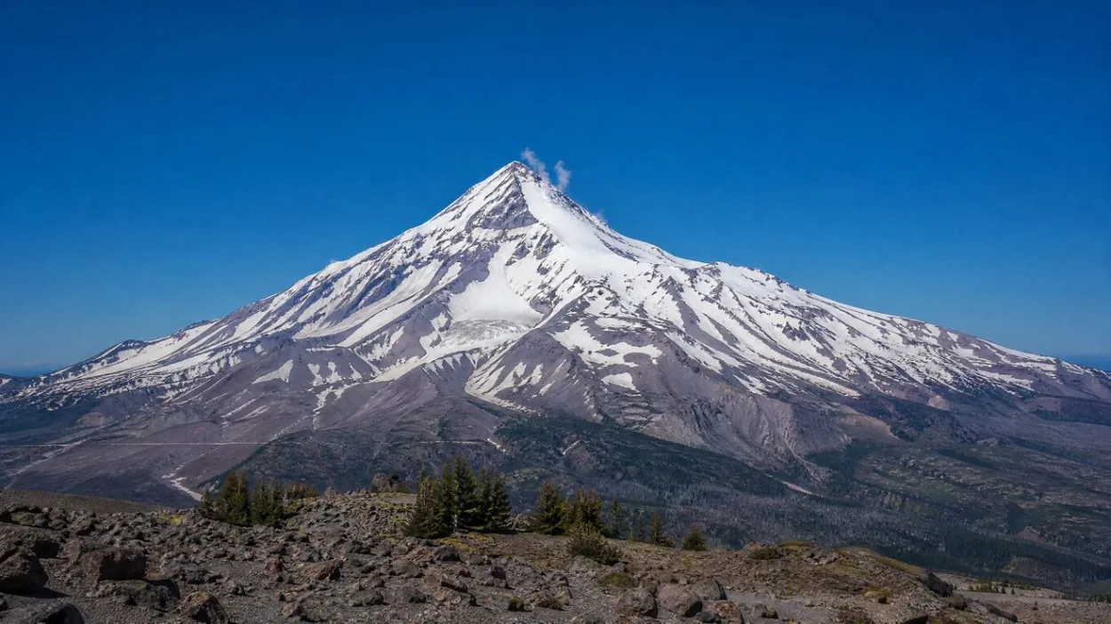 Snowy upper slopes of Mount Hood under a clear sky