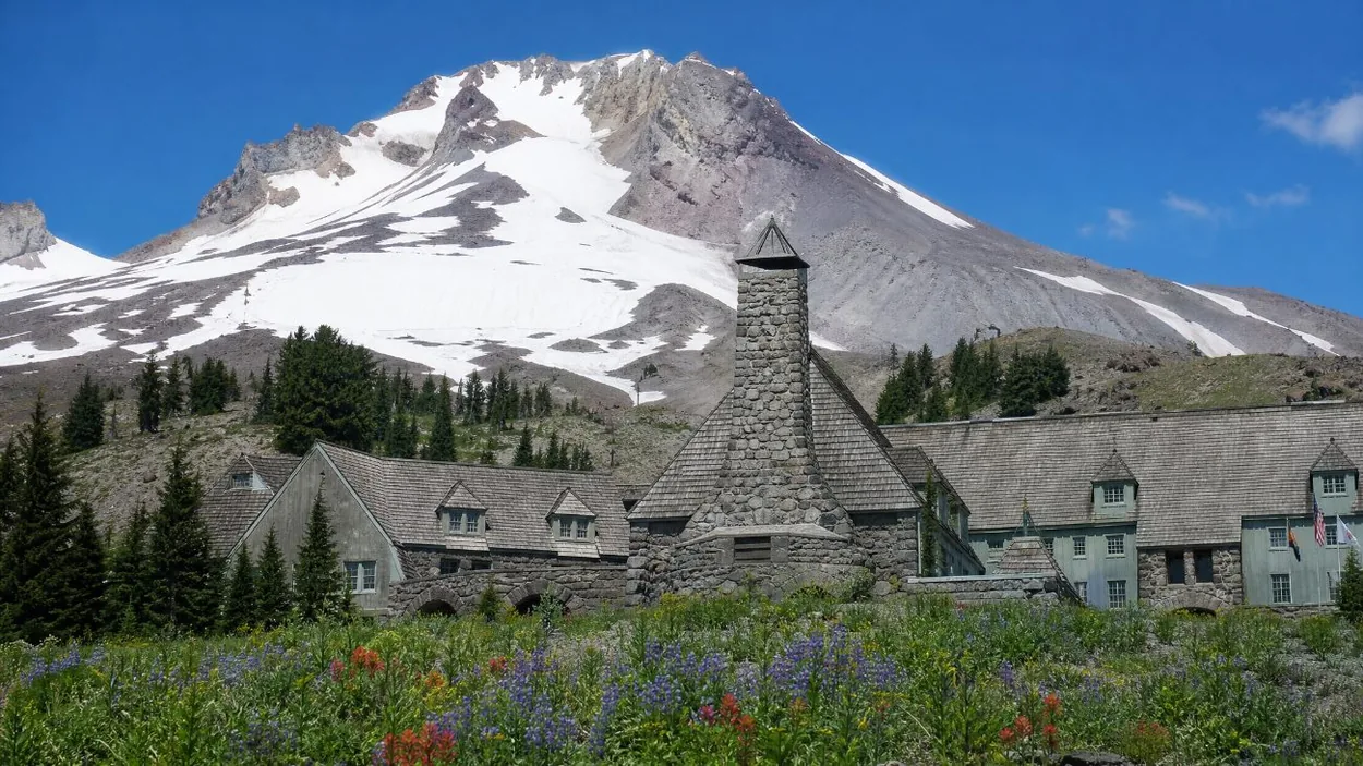 The stone and timber front of Timberline Lodge on a sunny summer day